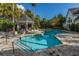 Community pool with a gazebo, lounge chairs, and mature landscaping at 45 Scyamore Ave # 623, Charleston, SC 29407