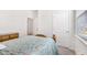 Bedroom with light colored walls, a bed, a large window, and dresser at 5000 Paddy Field Way, Ladson, SC 29456