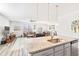 Open concept kitchen and living room features a modern design and ample lighting at 5000 Paddy Field Way, Ladson, SC 29456