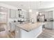 Open concept kitchen featuring granite countertops, a large island, and stainless steel appliances at 5000 Paddy Field Way, Ladson, SC 29456