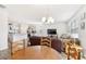 Bright living room with hardwood floors, modern lighting, and comfortable seating at 5000 Paddy Field Way, Ladson, SC 29456