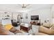 Spacious living room with a modern kitchen, stainless steel appliances, and lots of natural light at 5000 Paddy Field Way, Ladson, SC 29456