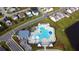 Overhead view of the community pool showcasing the modern design and lush landscaping at 5000 Paddy Field Way, Ladson, SC 29456
