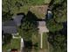 An aerial shot of the home showing the mature trees, other homes in the neighborhood, and the backyard at 5010 Converse St, North Charleston, SC 29405