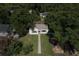 An aerial view of the home with mature trees showing the proximity to other homes in the neighborhood at 5010 Converse St, North Charleston, SC 29405