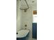 This bathroom has a modern bathtub, blue paneled walls, and chic tiled walls at 5010 Converse St, North Charleston, SC 29405