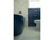 Stylish bathroom with a blue standalone tub, penny tile floors, and blue wainscoting at 5010 Converse St, North Charleston, SC 29405
