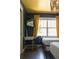Bright bedroom with large window, a desk, two beds, and stylish overhead lighting at 5010 Converse St, North Charleston, SC 29405