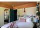 This bedroom features a bed with white linens, colorful curtains, and a full-length mirror at 5010 Converse St, North Charleston, SC 29405