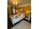 Well-lit bedroom featuring a comfortable bed, ample lighting, and dark wood floors at 5010 Converse St, North Charleston, SC 29405