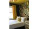 Charming bedroom with bright floral wallpaper, one bed, and stylish overhead lighting at 5010 Converse St, North Charleston, SC 29405