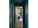 View of living room through hallway with beautiful blue trim and decor at 5010 Converse St, North Charleston, SC 29405