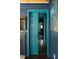 Hallway view through open sliding door showing teal walls and view to the bathroom at 5010 Converse St, North Charleston, SC 29405
