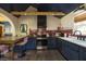 Modern kitchen with wooden beams, an archway, stainless steel appliances, and a bar at 5010 Converse St, North Charleston, SC 29405