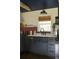 Modern kitchen with stainless steel appliances, a window, and dark blue cabinets at 5010 Converse St, North Charleston, SC 29405
