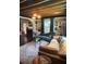 Inviting living room with exposed wood beams, stylish decor, and lots of natural light at 5010 Converse St, North Charleston, SC 29405