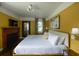 Bright and airy main bedroom with a fireplace, large bed, and a neutral color palette at 5010 Converse St, North Charleston, SC 29405