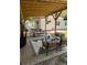 Relaxing outdoor patio with a large table, chairs, and a comfortable seating area at 5010 Converse St, North Charleston, SC 29405