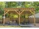 A beautiful covered patio featuring hammocks, a dining area and seating area to maximize backyard enjoyment at 5010 Converse St, North Charleston, SC 29405