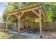 Backyard with a gorgeous pergola, featuring a dining area and cozy lounge space at 5010 Converse St, North Charleston, SC 29405