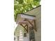 A nice side entry to the home has attractive wood features over the door and plenty of light at 5010 Converse St, North Charleston, SC 29405