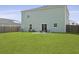 Spacious backyard featuring a well-maintained lawn and a patio area with a fire pit at 505 Spanish Wells Road Rd, Summerville, SC 29486