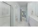 Bright bathroom with a glass door shower, toilet, and sink with white cabinetry at 505 Spanish Wells Road Rd, Summerville, SC 29486