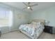 Comfortable bedroom with a floral comforter, side table and window at 505 Spanish Wells Road Rd, Summerville, SC 29486