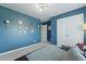 Bedroom showcasing blue walls, white trim and doors, a decorative chandelier, and wall art at 505 Spanish Wells Road Rd, Summerville, SC 29486
