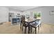 Bright eat-in kitchen area with a wooden table, granite counters, and backyard access at 505 Spanish Wells Road Rd, Summerville, SC 29486