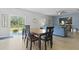Open-concept dining area with backyard view and table seating for four at 505 Spanish Wells Road Rd, Summerville, SC 29486