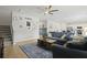 Open-concept living room with a large couch, area rug, and view into the dining room and kitchen at 505 Spanish Wells Road Rd, Summerville, SC 29486