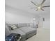 Neutral living room with gray sofa, ceiling fan, and plenty of natural light at 505 Spanish Wells Road Rd, Summerville, SC 29486