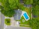 Aerial view of a home with a backyard pool, well-manicured lawn, and a driveway with a boat at 518 Woodward Blvd, Summerville, SC 29483