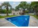 Backyard with a pool, covered deck, patio, outdoor shower and privacy fence at 518 Woodward Blvd, Summerville, SC 29483