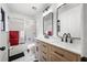 Bathroom featuring double sinks, vanity, modern fixtures, black framed mirror, shower and toilet at 518 Woodward Blvd, Summerville, SC 29483