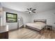 Bedroom with light hardwood flooring and view of backyard through window at 518 Woodward Blvd, Summerville, SC 29483
