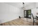 Dining room with wood floors, modern lighting, chair rail molding, and a door that opens to the outside at 518 Woodward Blvd, Summerville, SC 29483