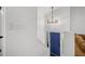 Bright entryway with a blue front door, modern chandelier, and view of the staircase and living area at 518 Woodward Blvd, Summerville, SC 29483