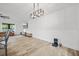 Living room area with modern light fixture and view to other rooms at 518 Woodward Blvd, Summerville, SC 29483