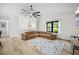 Bright and airy living room featuring a sectional sofa, modern lighting, large window, and a decorative rug at 518 Woodward Blvd, Summerville, SC 29483