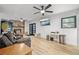 Bright living room features a fireplace, a TV, a ceiling fan and sliding glass doors at 518 Woodward Blvd, Summerville, SC 29483