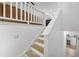 Bright staircase with white railings and light wood steps, connecting different levels of the home at 518 Woodward Blvd, Summerville, SC 29483