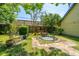The backyard showcases a charming pond and seating, providing a relaxing outdoor space at 5302 Helene Dr, North Charleston, SC 29418