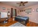 Cozy bedroom features a ceiling fan, hardwood floors, and neutral walls at 5302 Helene Dr, North Charleston, SC 29418