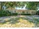 Charming one-story brick home with lush landscaping and mature trees at 5302 Helene Dr, North Charleston, SC 29418