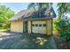 A detached garage with a concrete driveway, showing its functional design at 5302 Helene Dr, North Charleston, SC 29418
