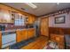 A fully equipped kitchen featuring wooden cabinets, stainless steel appliances, and tile backsplash at 5302 Helene Dr, North Charleston, SC 29418