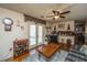 Cozy living room featuring ceiling fan, comfortable seating, and access to the outdoor area at 5302 Helene Dr, North Charleston, SC 29418