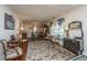 Formal living room featuring hardwood floors, decorative chandelier, and traditional furnishings at 5302 Helene Dr, North Charleston, SC 29418
